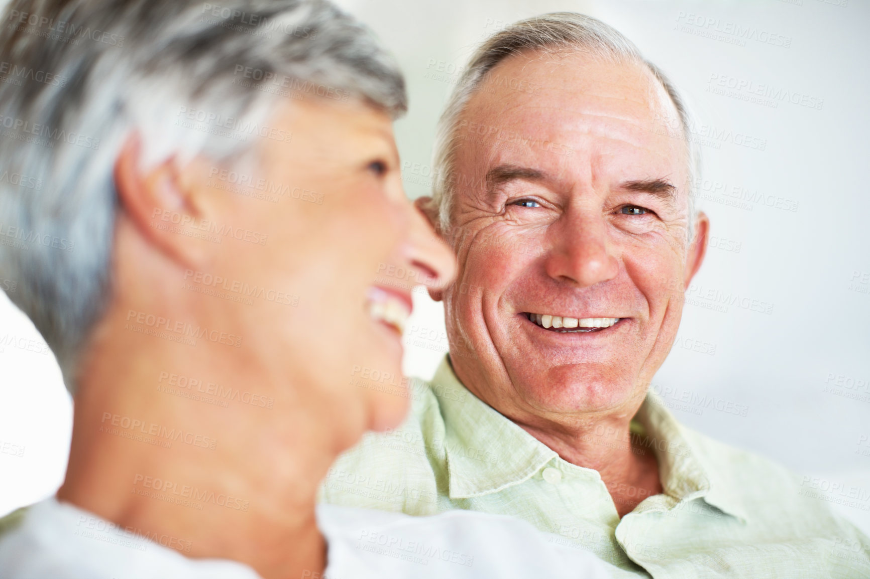 Buy stock photo Senior couple, happy and love on sofa for relax, bonding and portrait with support, care and together in home. Elderly people, smile and comfort on couch for weekend, marriage and embrace with trust