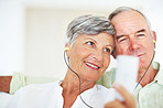 Mature couple listening music together