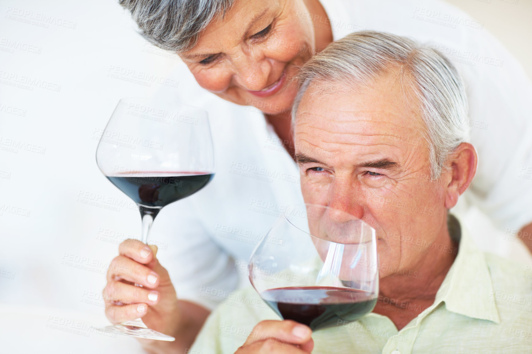 Buy stock photo Mature couple, red wine or glasses with alcohol for tasting, celebration or date together at home. Elderly, man and woman with drink or alcoholic beverage for romance, holiday or bonding at house