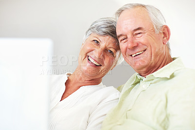 Buy stock photo Senior couple, laptop and portrait in home, surfing social media and internet for communication. Elderly people, relax and together for bonding in living room, reading funny ebook and streaming film