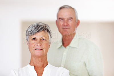 Buy stock photo Portrait of confident mature woman with handsome man in background