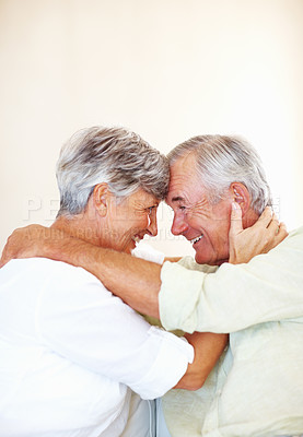 Buy stock photo Elderly couple, happy and love in home for relax, bonding and moment with support, care and romance. Senior people, smile and connection in house for weekend break, marriage and embrace with trust