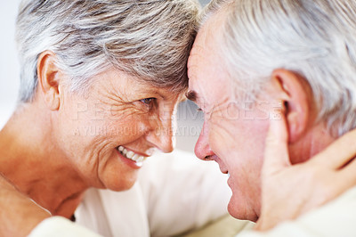 Buy stock photo Closeup of romantic mature couple smiling head to head