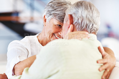 Buy stock photo Elderly couple, happy and romance in home for relax, bonding and love with support, care and together. Senior people, smile and connection in house for weekend break, marriage and embrace with trust