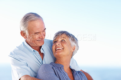 Buy stock photo Closeup of loving mature couple looking at each other while spending time outdoors