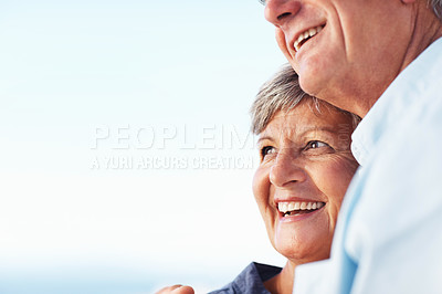 Buy stock photo Closeup of happy mature woman and man smiling against sky