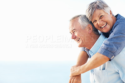 Buy stock photo Portrait of happy mature man giving piggyback ride to woman outdoors with arms outstretched