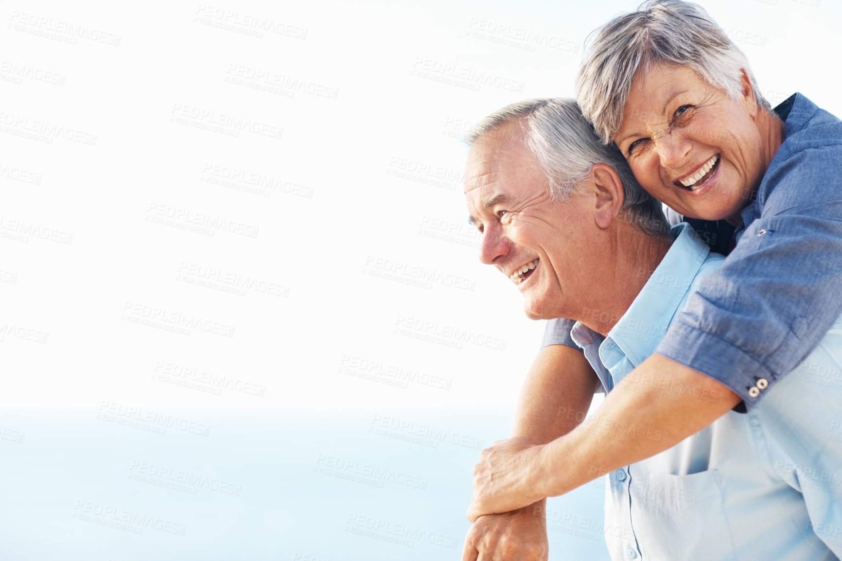 Buy stock photo Love, blue sky and elderly couple with smile, hug and bonding for retirement play. Happy, embrace and senior man with woman and romantic date, holiday or vacation together with honeymoon in Canada