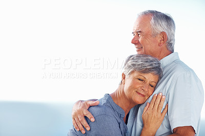 Buy stock photo Mature woman resting head on man's chest while spending time outdoors