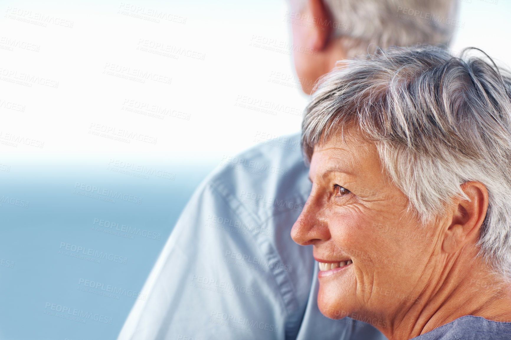 Buy stock photo Love, hug and elderly couple with smile, back and bonding for retirement ocean view. Happy, embrace and senior woman with man and romantic date, holiday or vacation together with blue sky in Canada