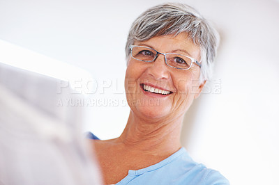 Buy stock photo Senior woman, newspaper and home portrait, headline announcement and relax in retirement. Female person, check article story and reading paper for information update, global event and print media