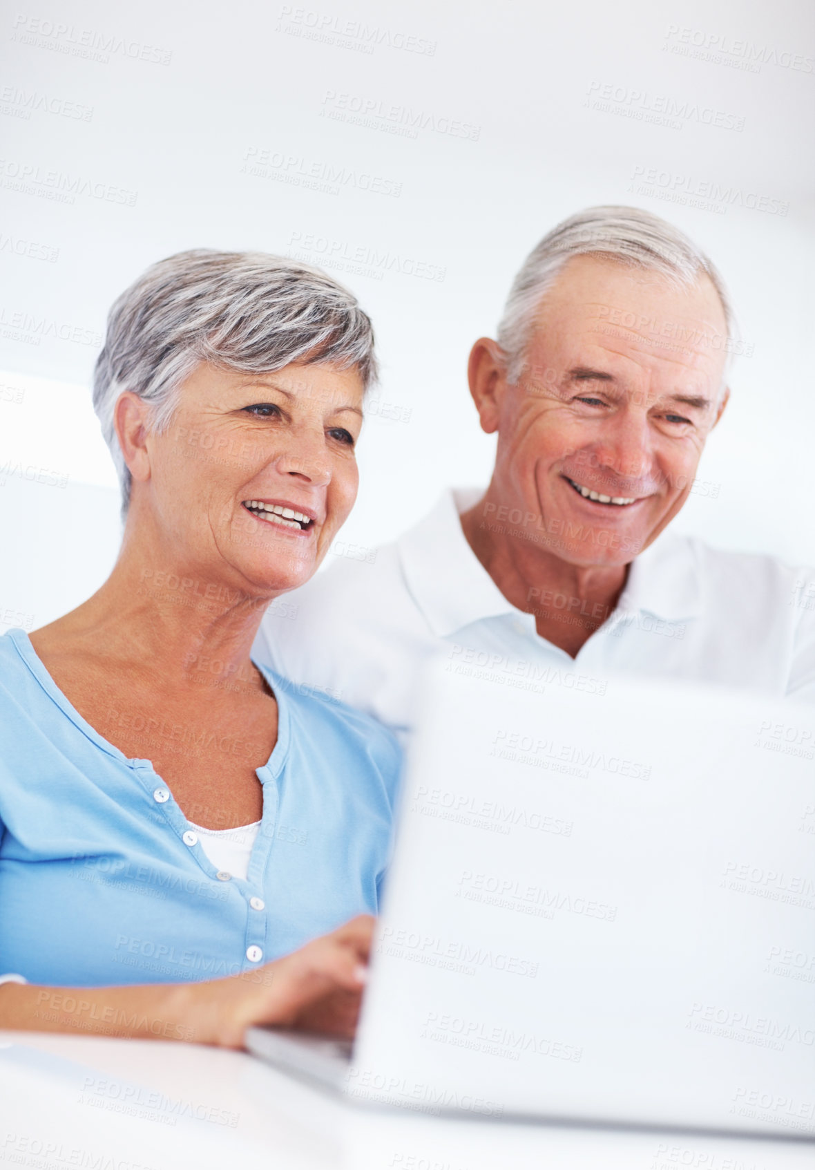 Buy stock photo Happy mature woman and man using laptop at home