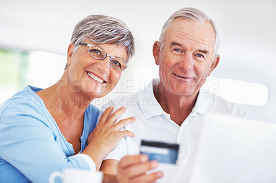 Buy stock photo Portrait smiling mature couple shopping online using credit card and laptop