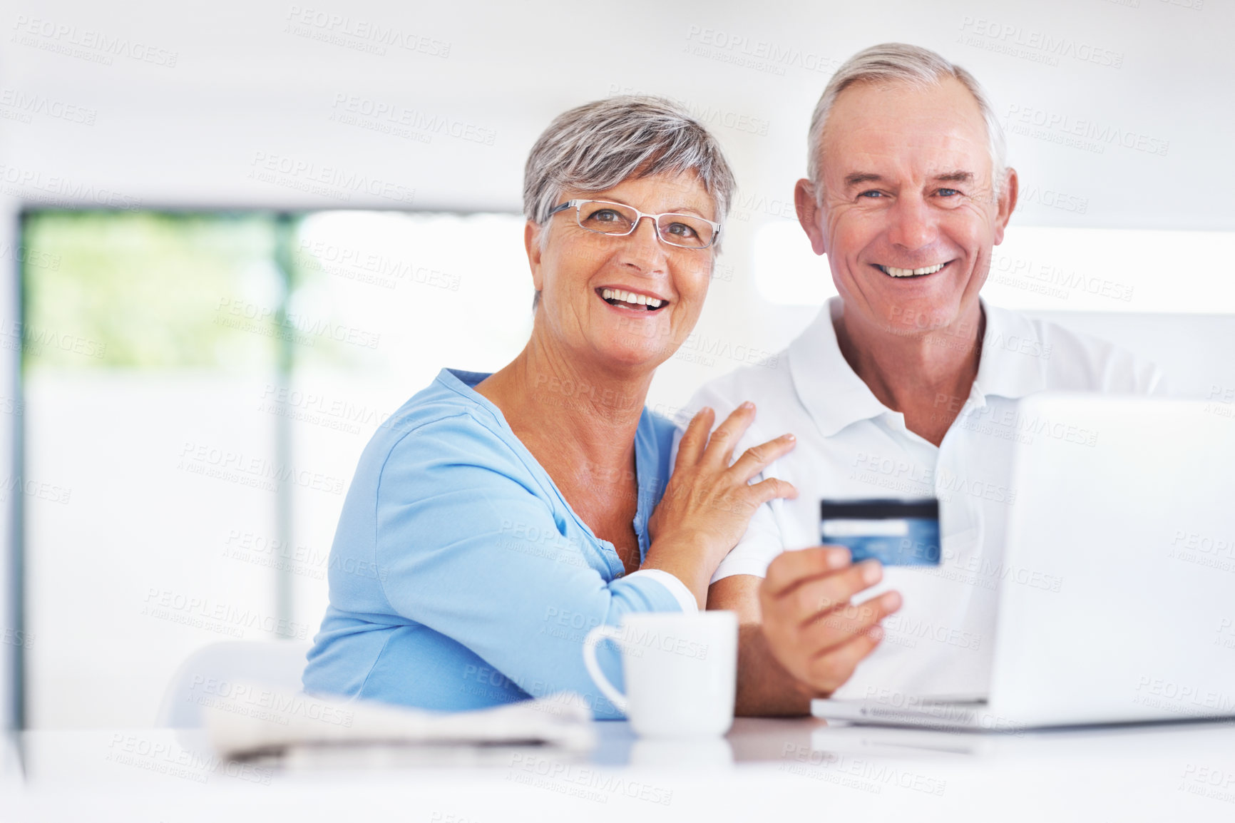 Buy stock photo Elderly couple, laptop and credit card for online shopping, portrait and purchase in kitchen. Senior man, woman and ecommerce for payment, subscription or sales review for home or retirement planning