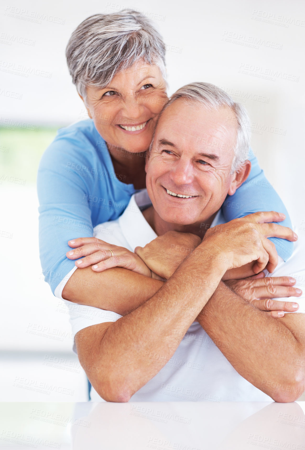 Buy stock photo Kitchen, senior couple and thinking with embrace for love, connection and bonding together in retirement. Elderly people, woman and man with hug in marriage, commitment and security for care at home