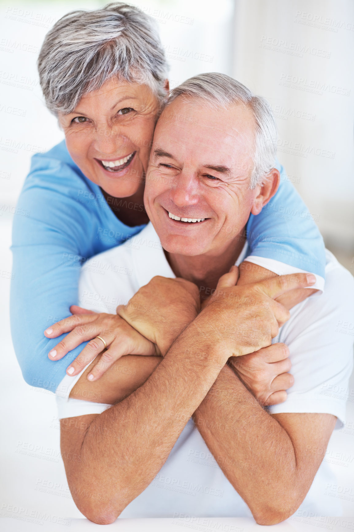 Buy stock photo Kitchen, elderly couple and portrait with hug for love, connection and bonding together in retirement. Senior people, woman and man with embrace in marriage, commitment and security for care at home