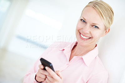 Buy stock photo Happy woman, portrait and typing with phone for communication, social media or new app at office. Young, female person or employee with smile on mobile smartphone for business chat, text or browsing