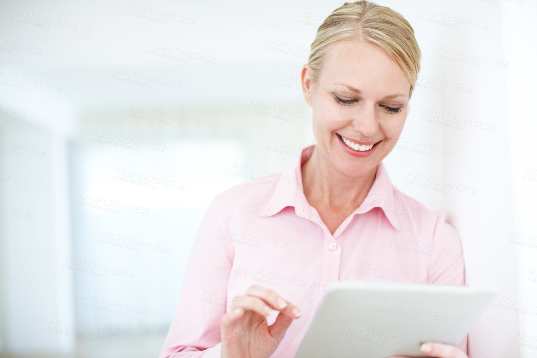 Buy stock photo Happy woman, browsing and scrolling with tablet for business, communication or social media at office. Young, female person or employee with smile on technology for online app or network at workplace