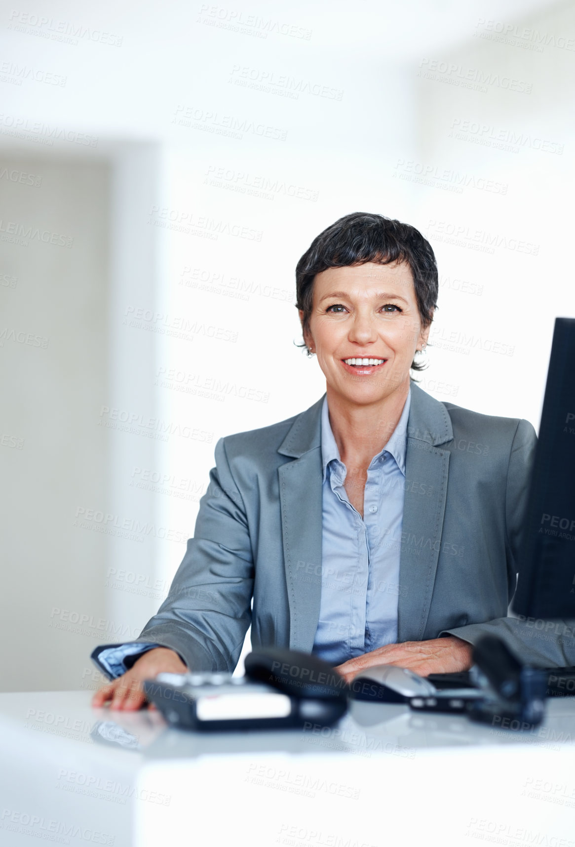 Buy stock photo Portrait of mature business woman smiling at office desk