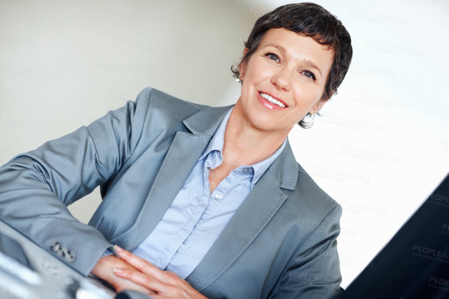 Buy stock photo Corporate, portrait and smile with mature woman at desk in office for professional management career. Business, company and executive with confident employee person in workplace for empowerment