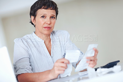 Buy stock photo Tensed female executive calculating taxes in office