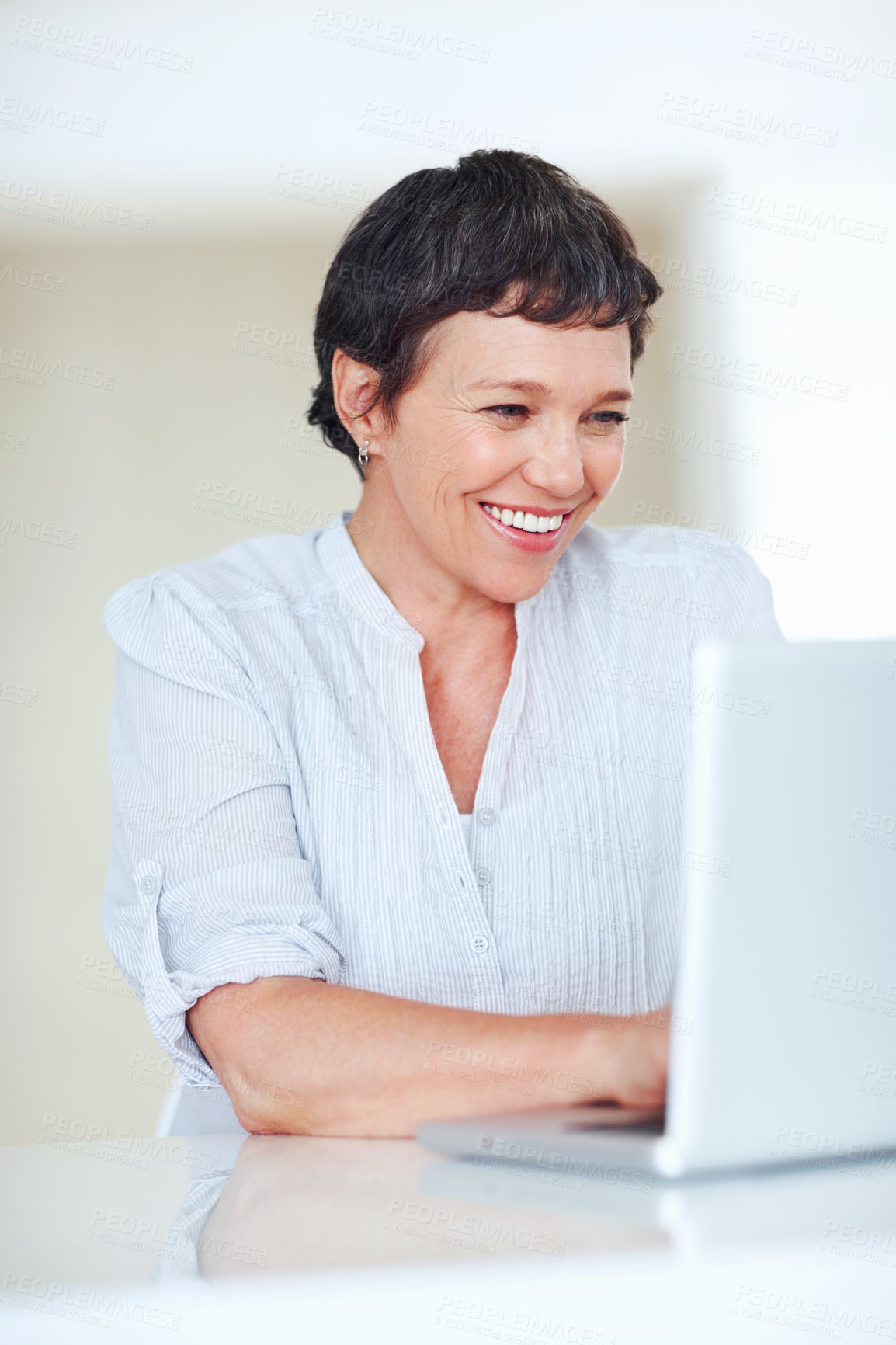 Buy stock photo Mature woman, happy and laptop for business research, communication and networking clients in office. Accountant, happy and technology for financial spreadsheet, profit report and bookkeeping app