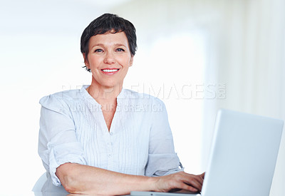 Buy stock photo Mature woman, portrait and laptop for business research, communication and networking clients in office. Accountant, happy and technology for financial spreadsheet, profit report and bookkeeping app