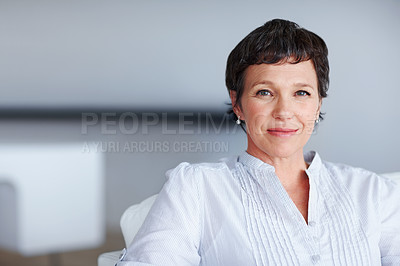 Buy stock photo Mature woman, confident and portrait in home on couch to relax with pride in lounge and living room. Real estate agent, chill or face of female person resting in France break, wellness or day off