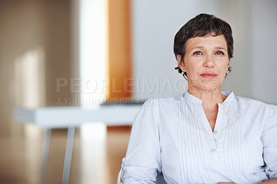 Buy stock photo Mature woman, serious and portrait in home on couch to relax with pride in lounge and living room. Real estate agent, confident or face of female relator resting in France break, wellness or day off