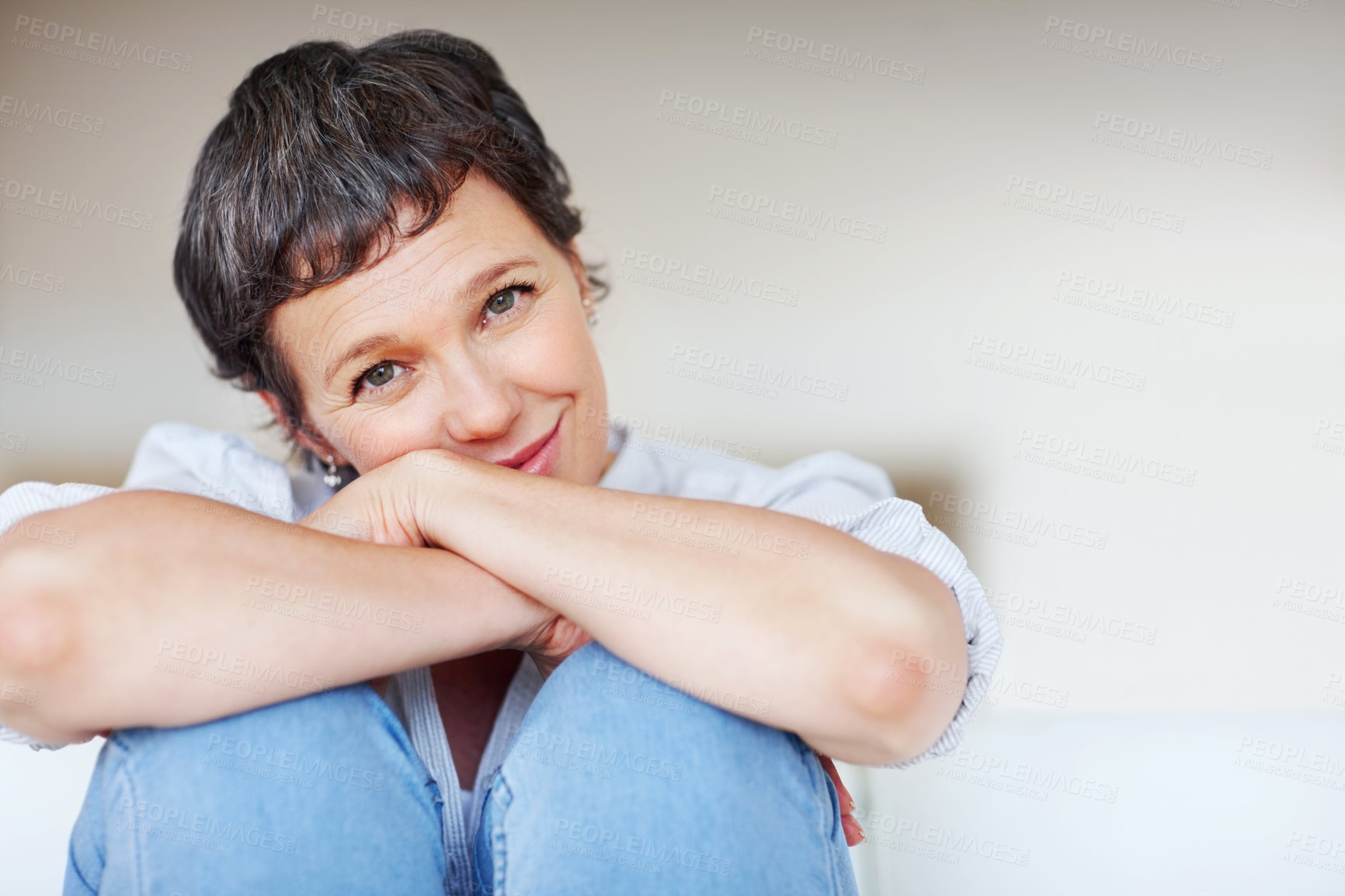 Buy stock photo Mature woman, shy and portrait in home on couch to relax with space in lounge and living room. Introvert, chill or face of female person resting in France for break, wellness or day off with peace