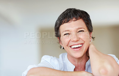 Buy stock photo Portrait of mature business woman smiling while relaxing at home