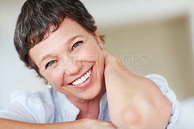 Buy stock photo Mature woman, happy and portrait in apartment to relax with pride in lounge, home and house. Real estate agent, smile or face of female person resting to chill in France break, wellness or day off