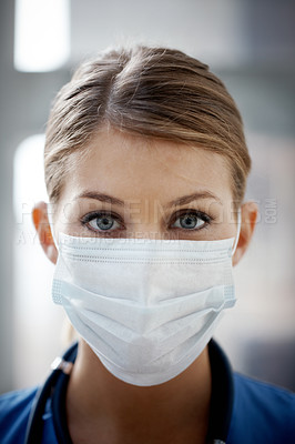 Buy stock photo Closeup of a female surgeon wearing a surgical mask- portrait