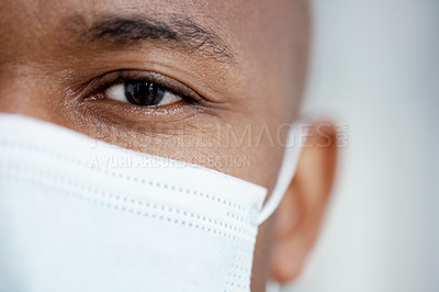 Buy stock photo Cropped image of an African-American surgeon wearing a surgical mask