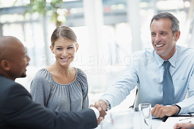 Buy stock photo Happy, business people and meeting with handshake for deal, teamwork or collaboration at office. Businessman, colleagues or employees shaking hands for contract agreement, b2b or mission at workplace