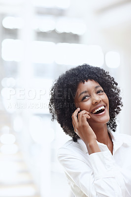 Buy stock photo A young african-american woman talking on her cellphone