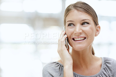 Buy stock photo A beautiful young woman talking on her cellphone