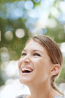 Buy stock photo A beautiful young woman smiling happily