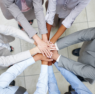 Buy stock photo Merged colleagues put their hands together to celebrate their unity