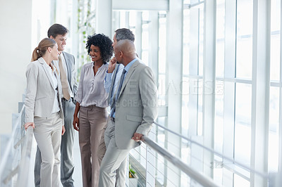 Buy stock photo Business colleagues stop to have a conversation in their workplace - Copyspace