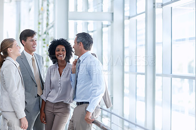 Buy stock photo Diverse business partners having a discussion while at their workplace - Copyspace