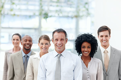 Buy stock photo Diverse business team stand confidently with their team leader - Copyspace