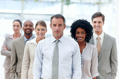 Buy stock photo Confident business team stand facing you ready to take on any business ventures
