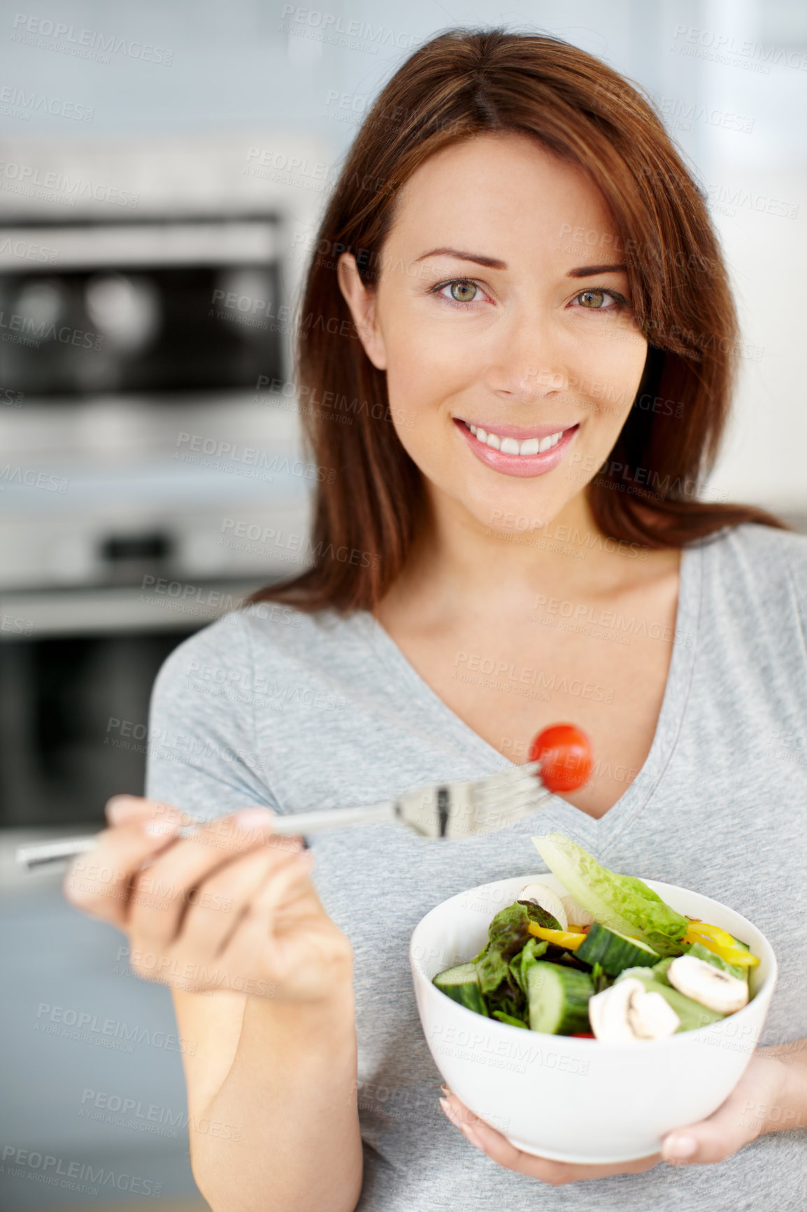 Buy stock photo Health, salad and portrait of woman eating vegetables for nutrition or vegan diet in home kitchen. Happy person, smile and food for detox, wellness benefits and weight loss goals for self care