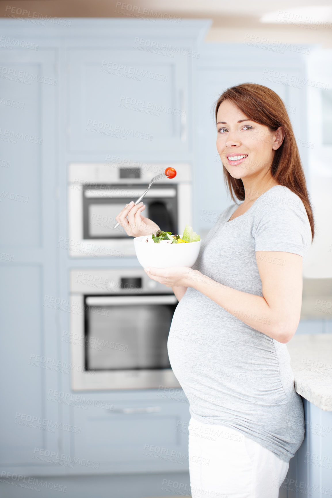 Buy stock photo Portrait, eating or pregnant woman with salad in home with smile, healthy breakfast or fruits for vitamins. Happy, hungry and mother to be with organic food for wellness, benefits and diet nutrition