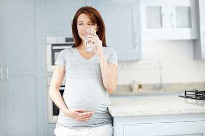 Buy stock photo Pregnant woman, thinking and drinking water in home, nutrition and aqua for hydration in kitchen. Prenatal ideas, maternity detox and mineral liquid for energy, health or refreshing beverage in glass