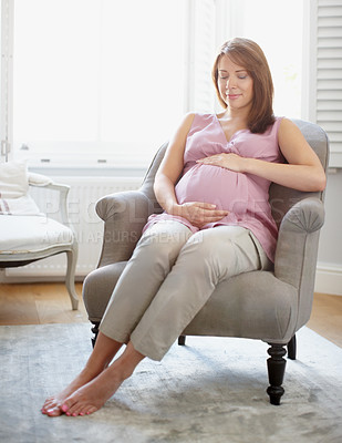 Buy stock photo Pregnant woman, wellness and sofa in relax, happiness or comfort for baby development in living room. Female person, stomach and rest as mother for growth on weekend for break, peace and calm in home