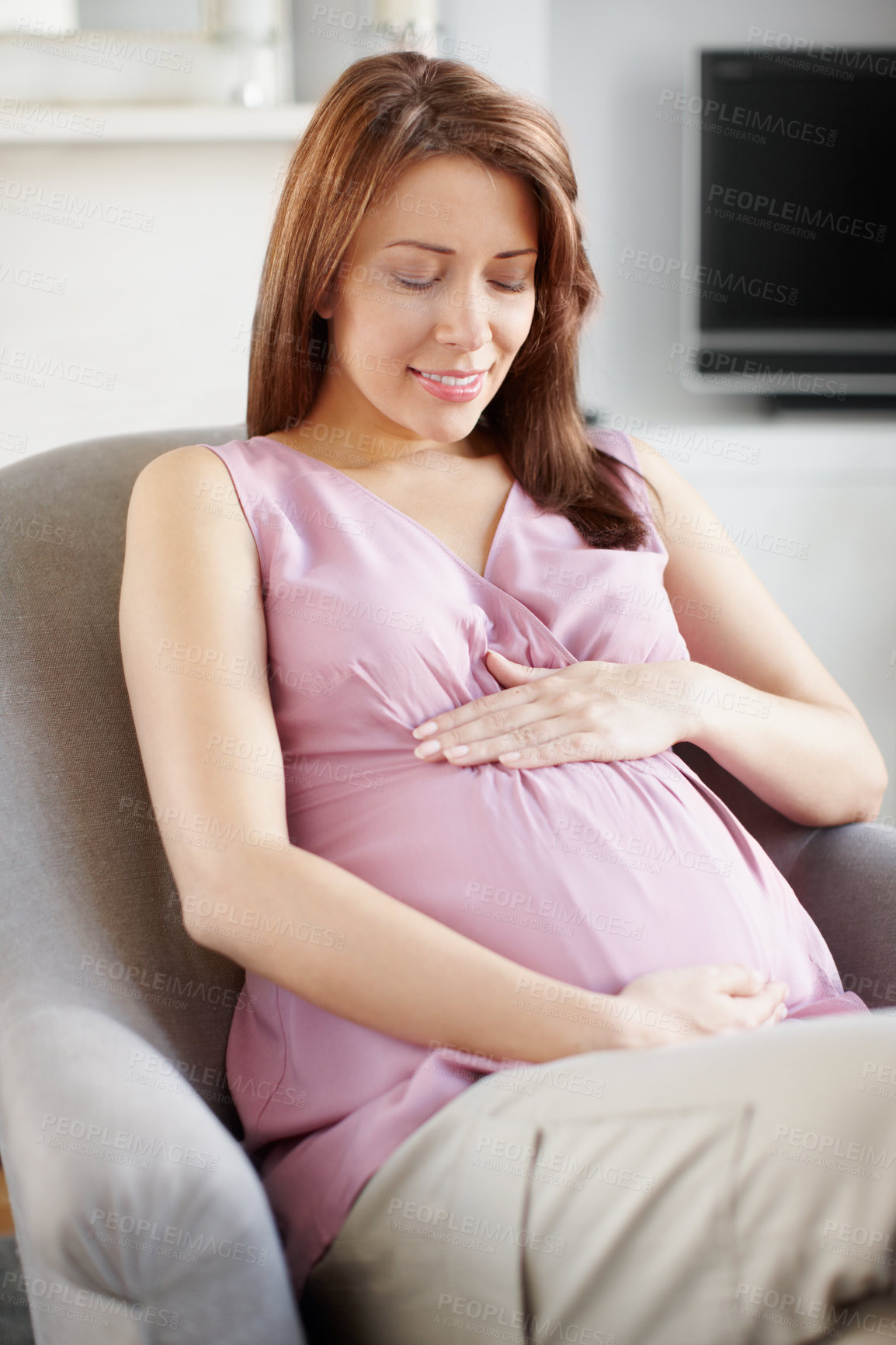 Buy stock photo Pregnant woman, wellness and rest in relax, comfort or happiness for baby development in living room. Female person, stomach and sofa as mother for growth on weekend for break, peace and calm in home