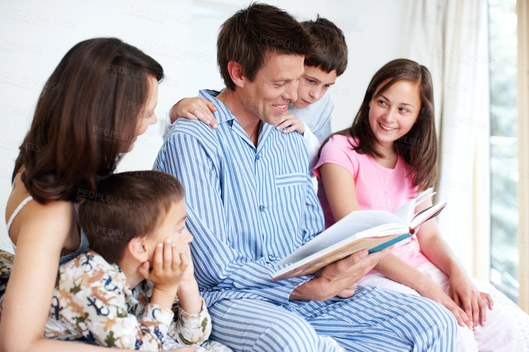 Buy stock photo Family, kids and parents reading book, story and siblings learning in home. Happy children, mother and father storytelling in bedroom for morning education, fantasy fairytale and bonding together