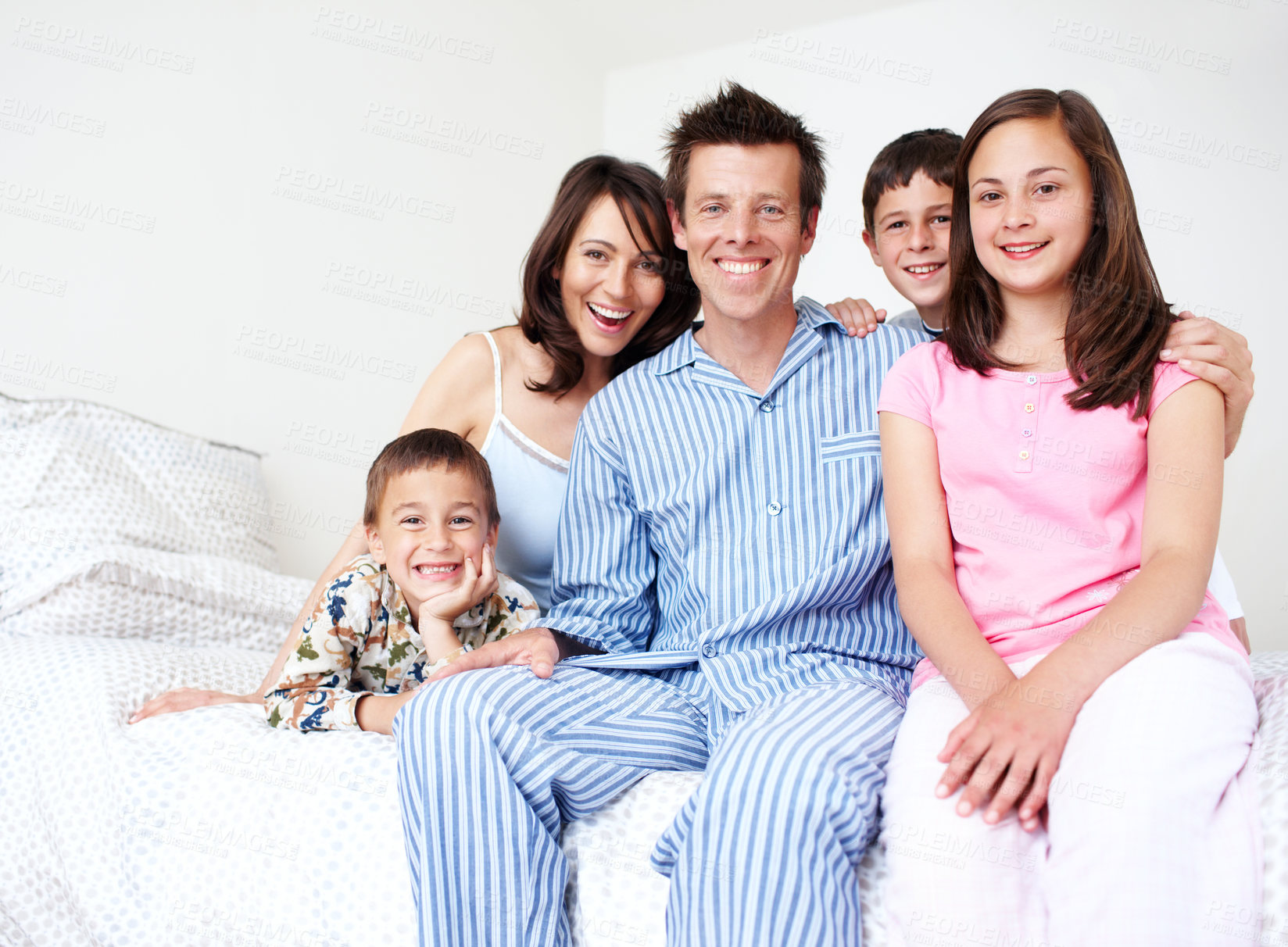 Buy stock photo Bedroom, pajamas and portrait of happy family with siblings in home for support, love or wellness. Smile, mother or father with boys children and kids for bonding together with parents in morning